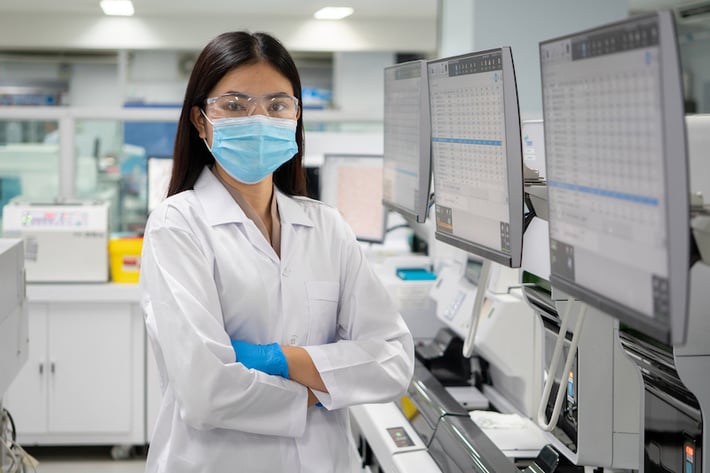 Female scientist in coat at a laboratory