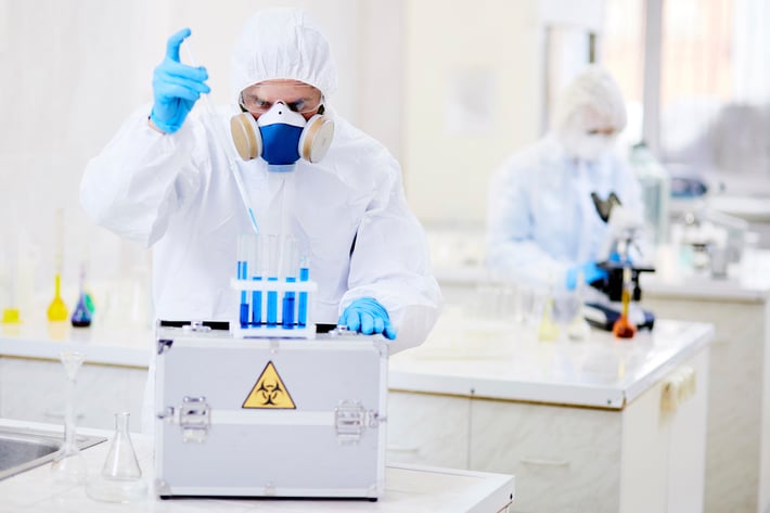 Scientists preparing samples in laboratory